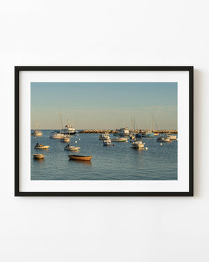Boats anchored in warm light in a sheltered New Hampshire harbour