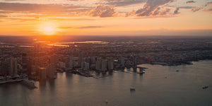 Aerial view of New Jersey waterfront towers beneath an orange sky