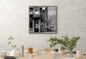 New York City facade with graffiti tags and pasted character artwork