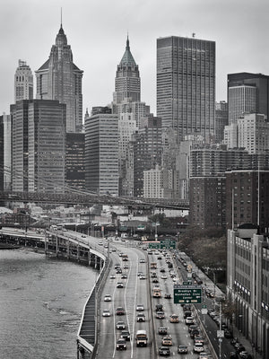 Lower Manhattan skyscrapers and curving waterfront highway