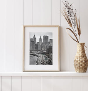 View of the New York skyline and a busy riverside highway