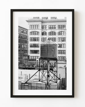 Classic New York City water tower against urban skyline