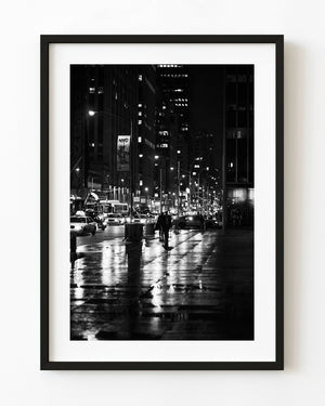 New York street at night after rain in black and white