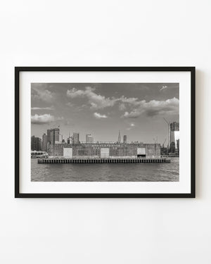 New York Pier 76 terminal facade across the Hudson River in black and white