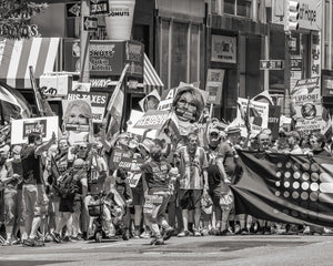 Marchers carrying placards and flags on a New York street
