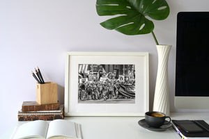 Black and white documentary photograph of a Pride parade demonstration