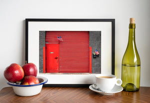 New York architectural detail with red steel doors and small flags