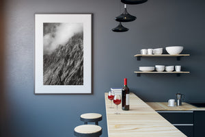 Mist and shadow across a steep New Zealand mountain slope
