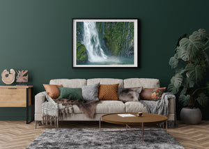Soft cascading waterfall against textured stone in New Zealand landscape