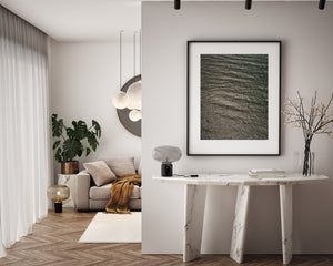 Silver highlights tracing gentle ocean swells from above