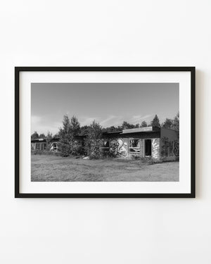 Graffiti-covered abandoned motel in Northern Ontario in black and white