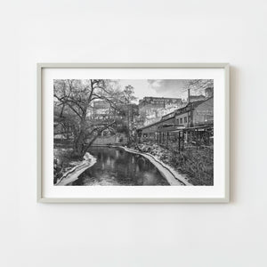 Winter riverside scene in Oslo with graffiti buildings in black and white