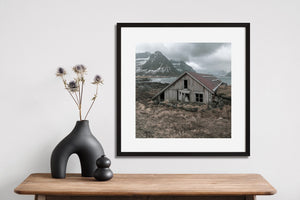 Broken windows and aged wooden boards on a coastal Norway hut