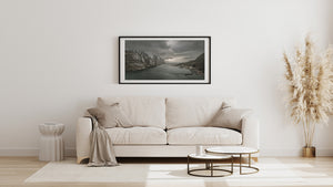Small coastal houses beneath rugged Norwegian slopes