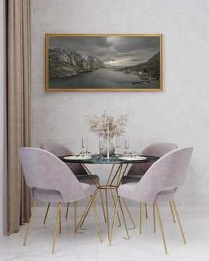 Wide view of a Norwegian fjord framed by steep mountains