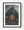 Orange Norwegian rorbu cabin beneath snow-streaked Olstinden