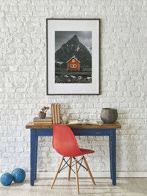Norwegian coastal cabin beneath a grey winter sky