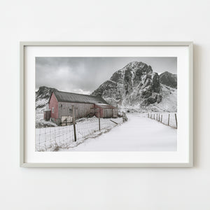 Rustic old barn in Flakstad, Norway with mountain backdrop