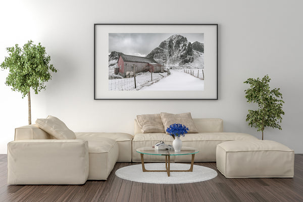 Vintage barn on quiet road under Norwegian skies