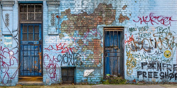 Urban decay and art on London's backstreet wall