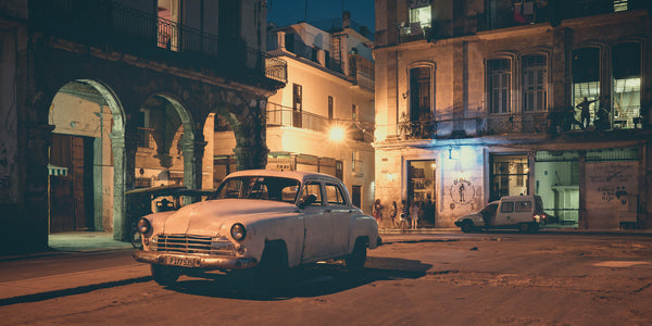 Cuban nightlife with white taxi