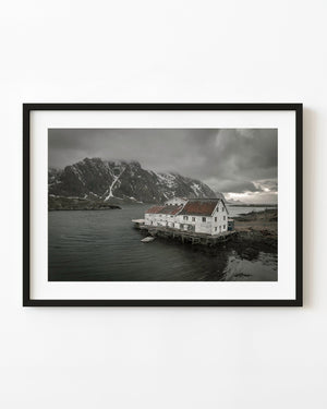 Old Lofoten hotel standing above dark coastal water