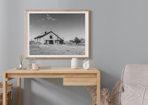 Black and white photograph of an old barn dated 1900