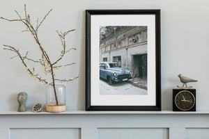 Classic car artwork featuring decaying architecture