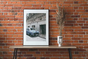 Vintage automobile photo print in weathered urban setting