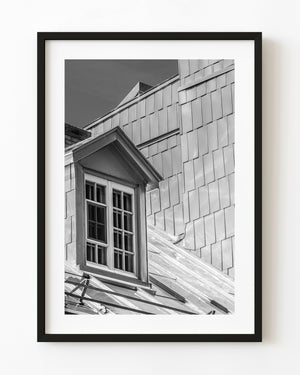 Old Quebec dormer window and metal roof in black and white