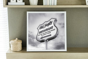 Vintage-style Route 66 sign with a bold left-pointing arrow