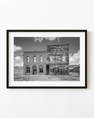 Old West ghost-town storefronts in black and white