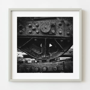 Close-up of old heavy machinery in black and white