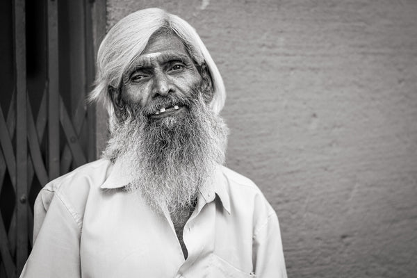 Black and white portrait smiling elderly man India