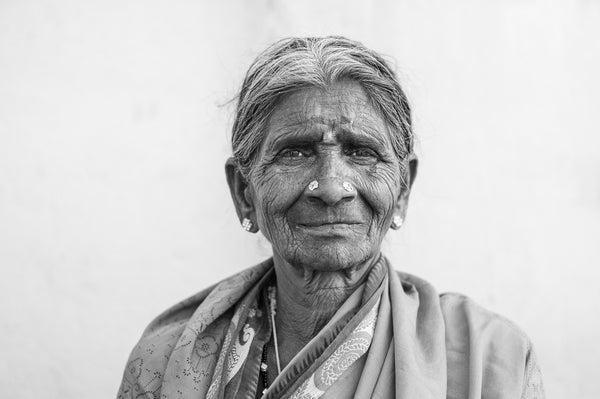 Graceful elderly woman in sari wall art