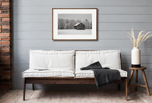 Rural countryside barn during snowstorm in Ontario Canada black and white