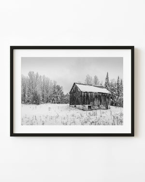 black and white barn in snowy Ontario countryside