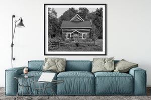 Historic rural Ontario cabin with weathered wooden fence black and white
