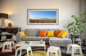 Distant mountain ridge beyond flat California grassland