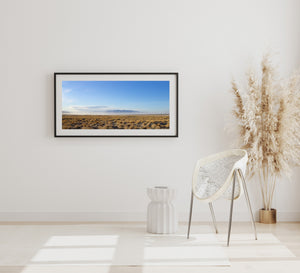 Colour panorama of open California country beneath a pale blue sky
