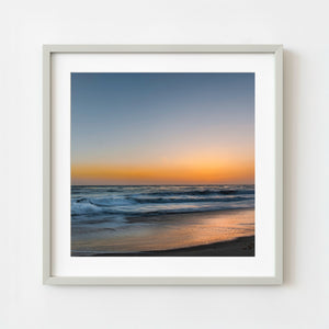 California coastline at sunset with soft waves