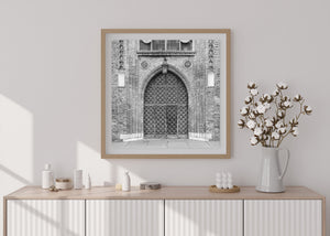 Weathered Gothic entrance with repeating diamond patterns in Gdansk