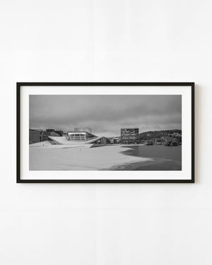 Oslo Opera House beside an icy waterfront, black and white winter photograph