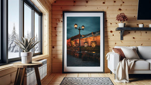Streetlamp illuminating stone buildings along Otaru canal