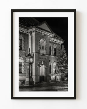 Steam clock outside historic brick building in Otaru Japan at night