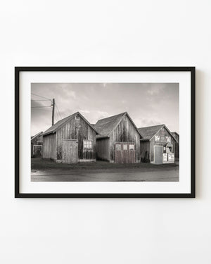 Black and white image of fishing huts on PEI’s coastline