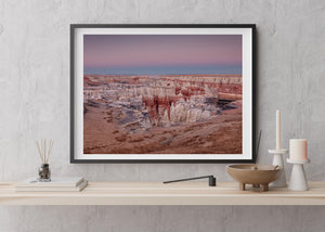 Colour landscape of banded canyon walls and pale stone pinnacles