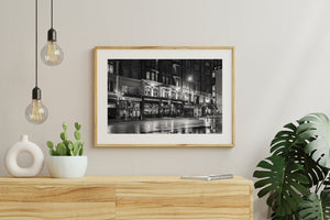 Nighttime street scene with glowing pub windows