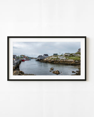 Peggy’s Cove fishing village with boats and wooden sheds along the rocky harbour