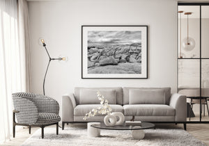 Textured boulders beneath a dramatic coastal sky in Nova Scotia